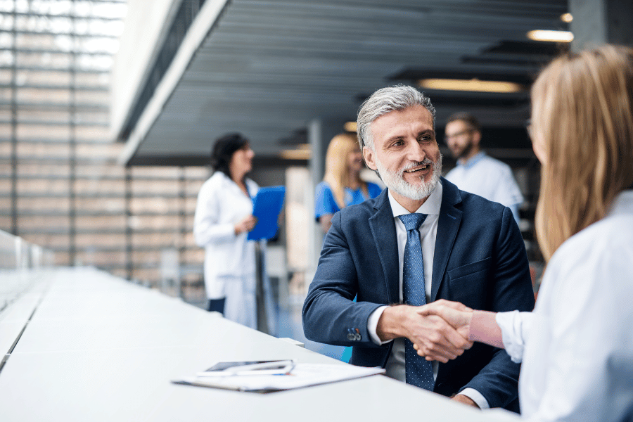 Man and woman business handshake